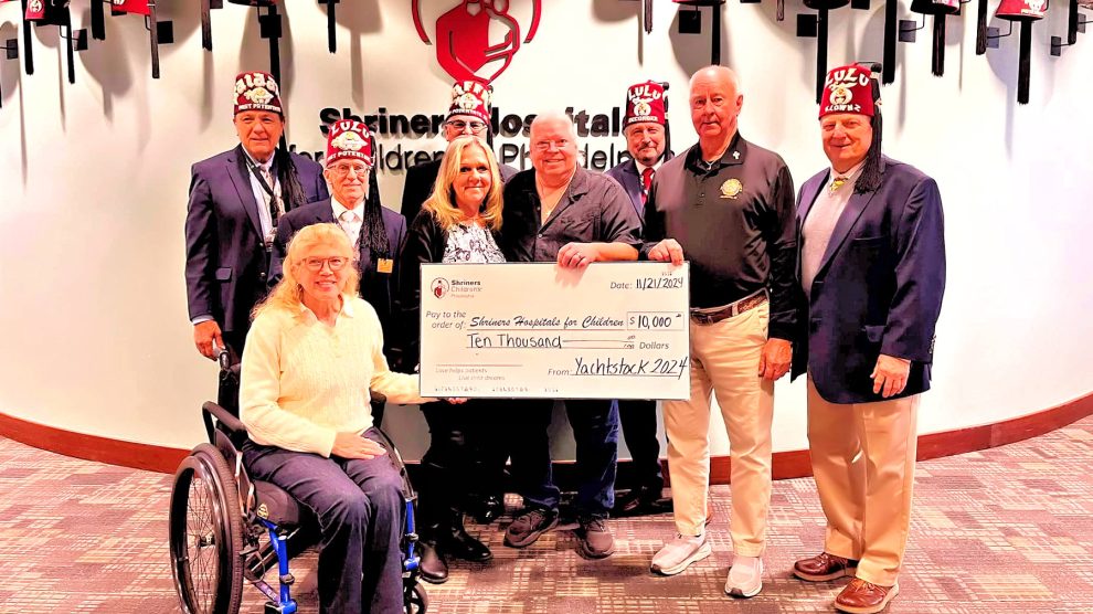 Yachtstock Board presents check to Shriners
